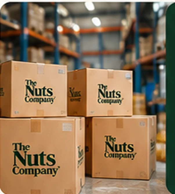 Printed cartons of The Nuts Company stacked in a warehouse